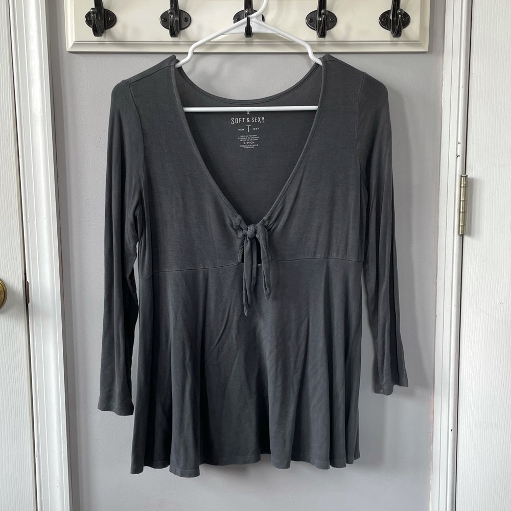gray shirt with tie detail